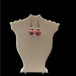 Handmade earrings. They are 1 1/2 inches long. Silver colored metal.